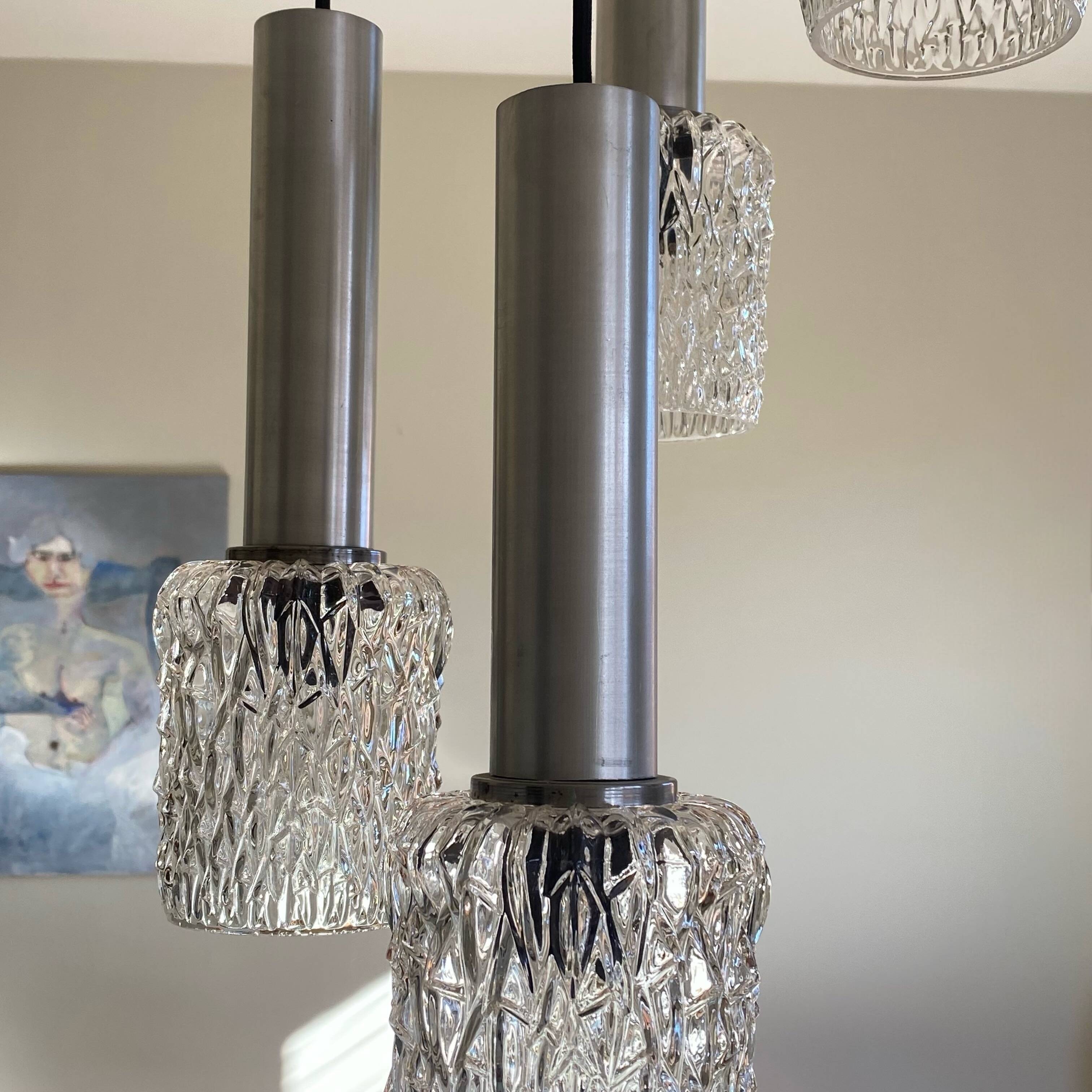 Large suspension chandelier with 5 glass lampshades and aluminium tube.
