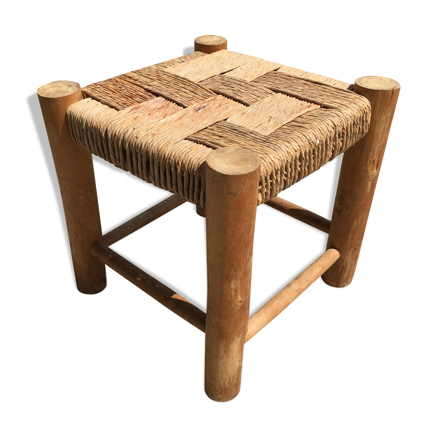 Wooden stool seated in braided rope