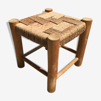 Wooden stool seated in braided rope