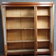 Large pine bookcase with three doors, fitted with frosted glass.