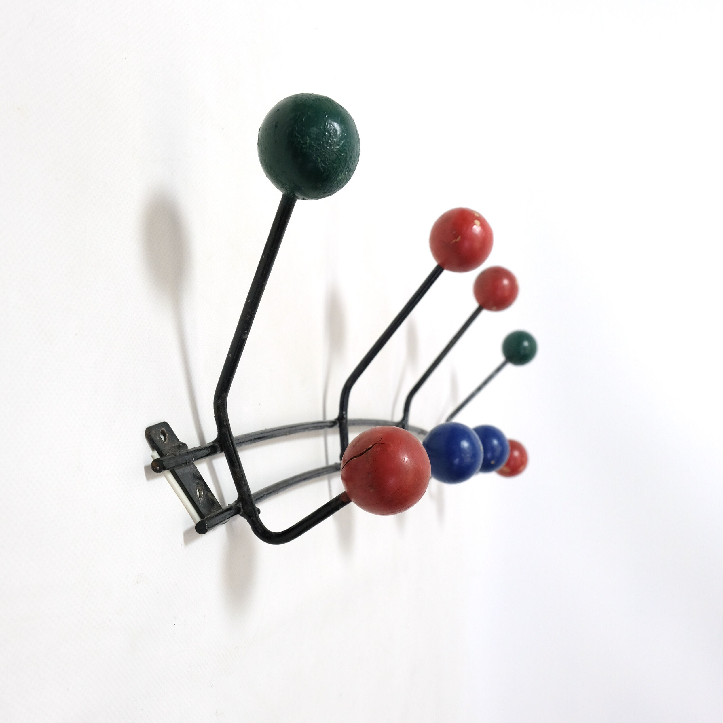 Multicolored wooden and metal coat holder
