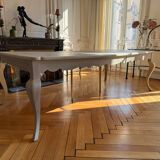 Large solid wood table made by a cabinetmaker.