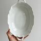 White fine porcelain soup tureen with relief decoration.