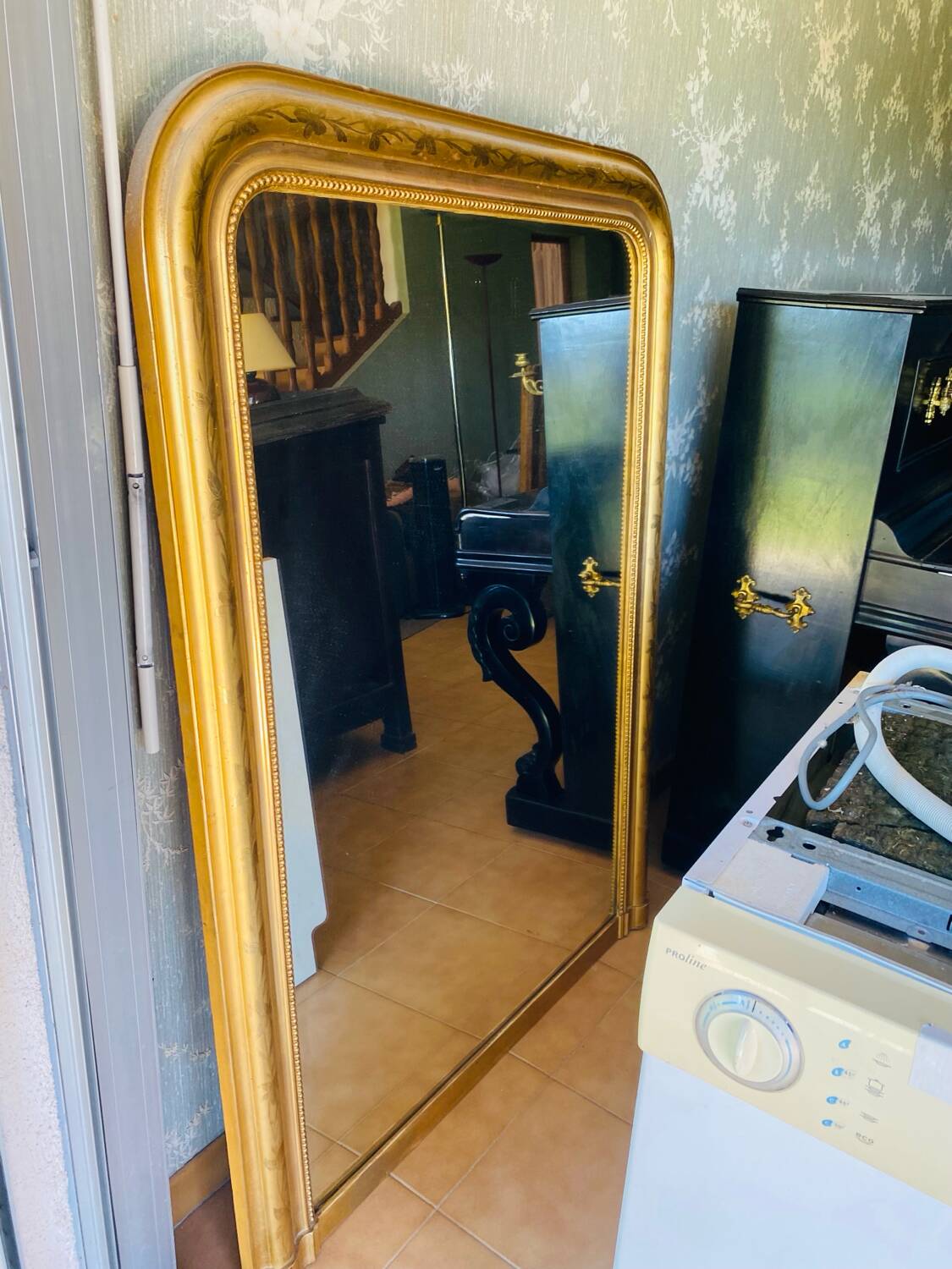 Large antique mirror with gold leaf in the Louis XV style.