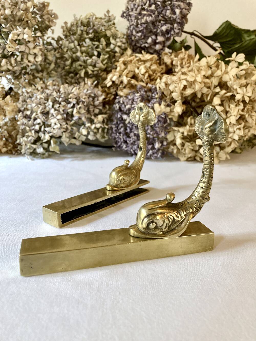 Brass wall supports for bathroom shelf, circa 1950.