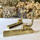 Brass wall supports for bathroom shelf, circa 1950.