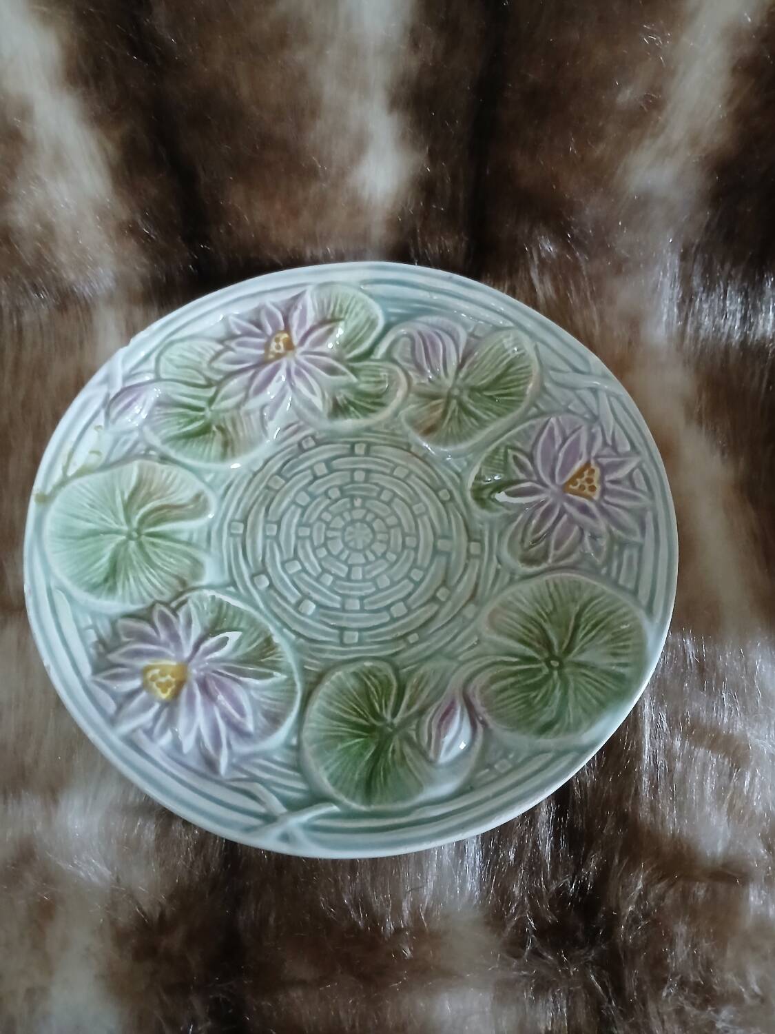 Antique cup and saucer in majolica.