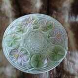 Antique cup and saucer in majolica.