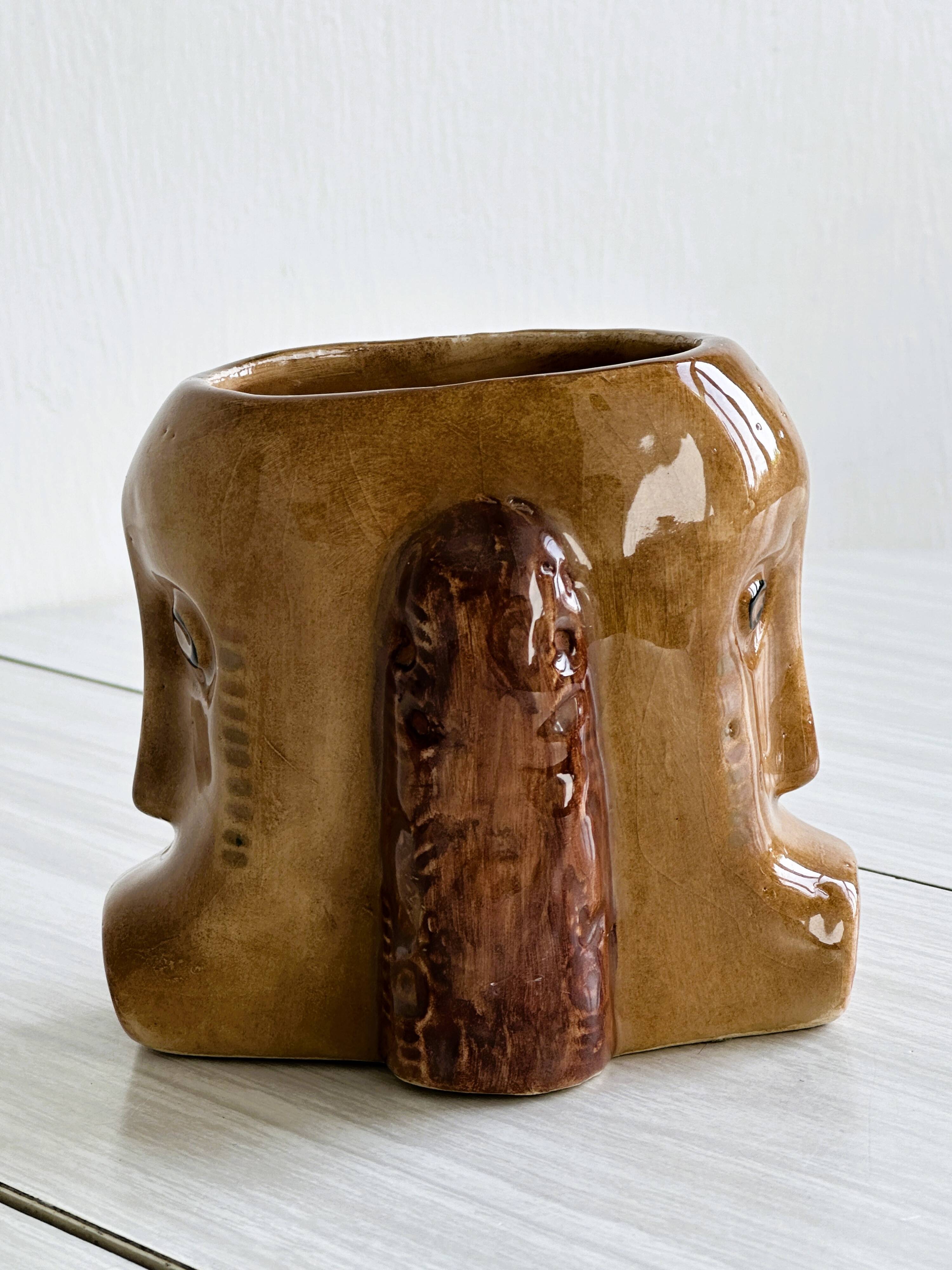 Faces ceramic mug.