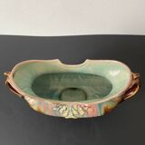 Old earthenware planter. Floral patterns.