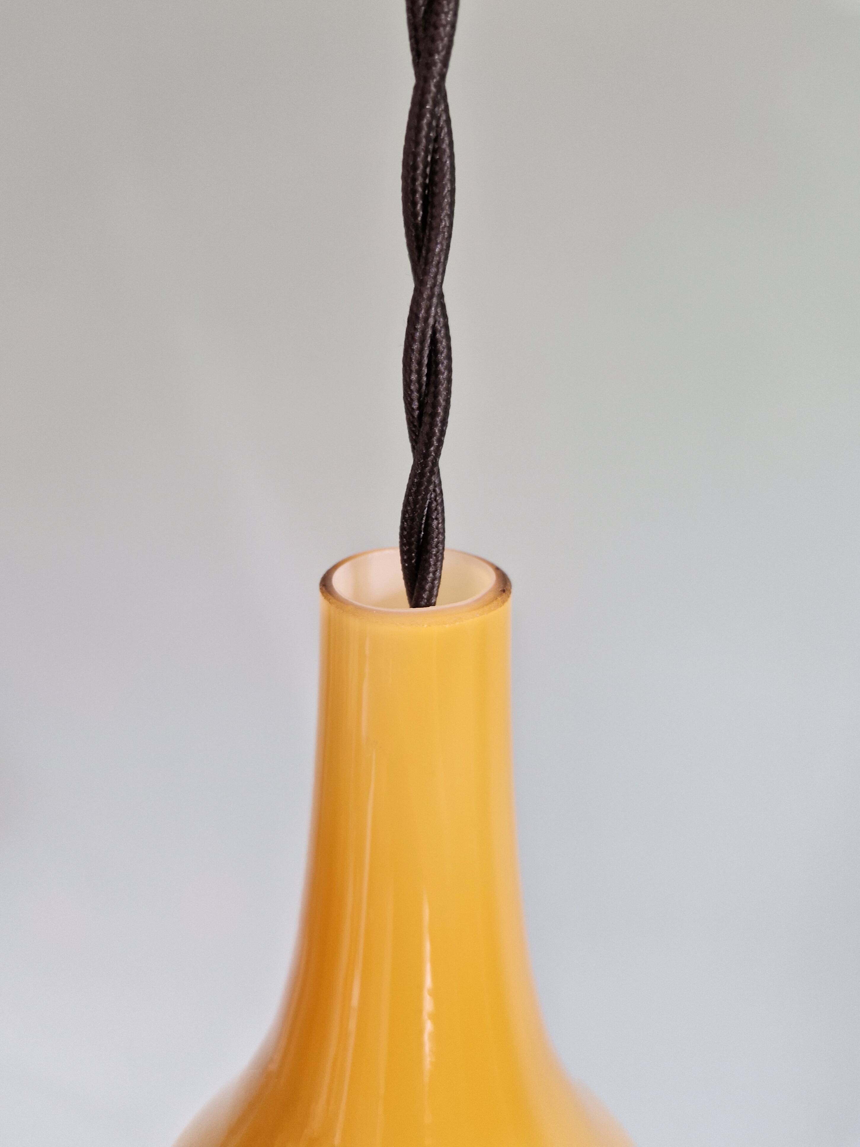 Scandinavian pendant light in honey-colored opaline glass, 1960s