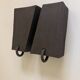 Pair of black stoneware graphic wall lights with handmade ring.