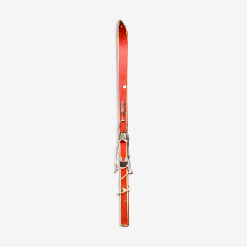 Pair of red antique skis