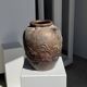 Large traditional Indonesian clay pot featuring a dragon.