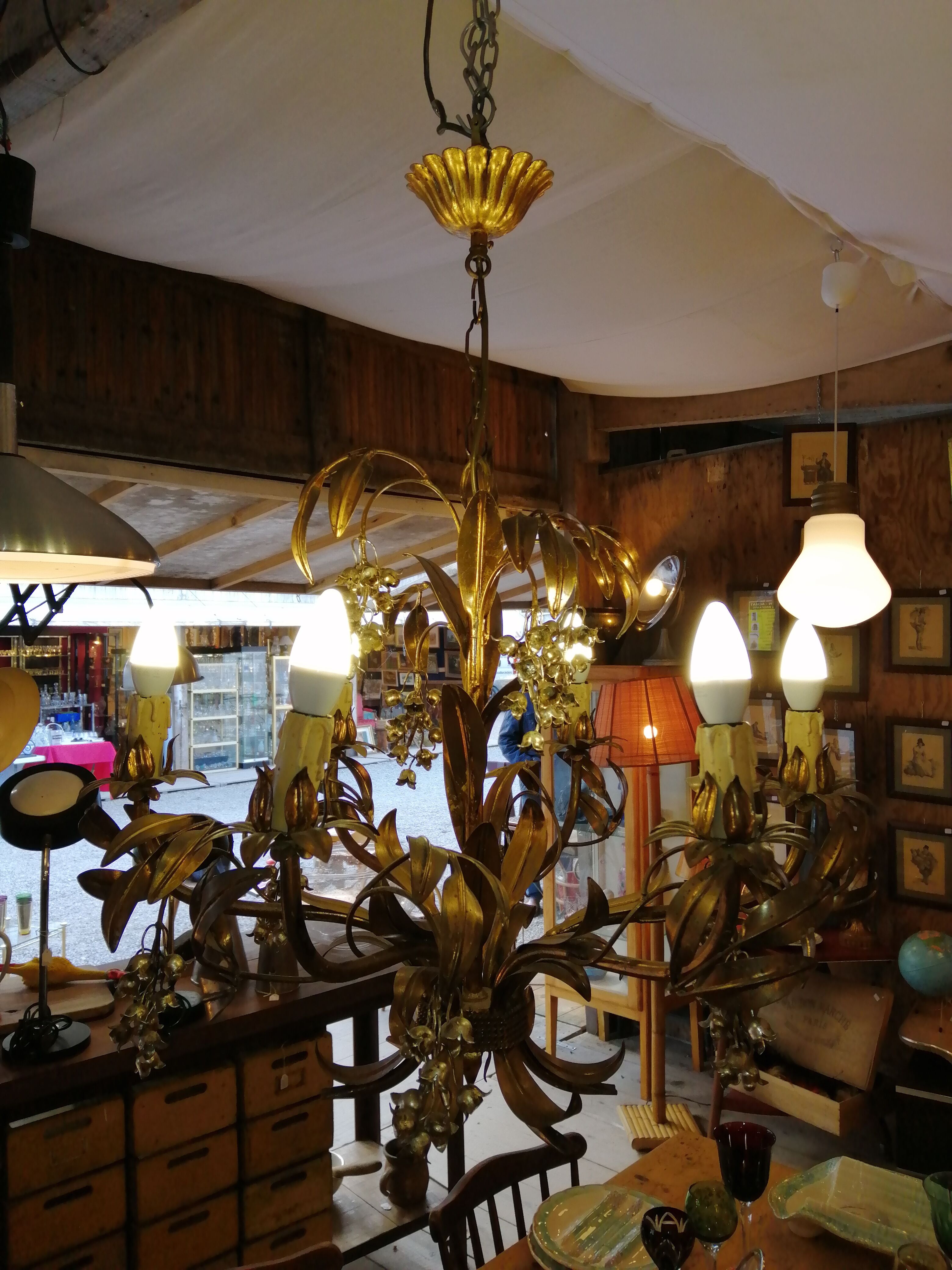 Gilded brass chandelier and silver lily of the valley bells