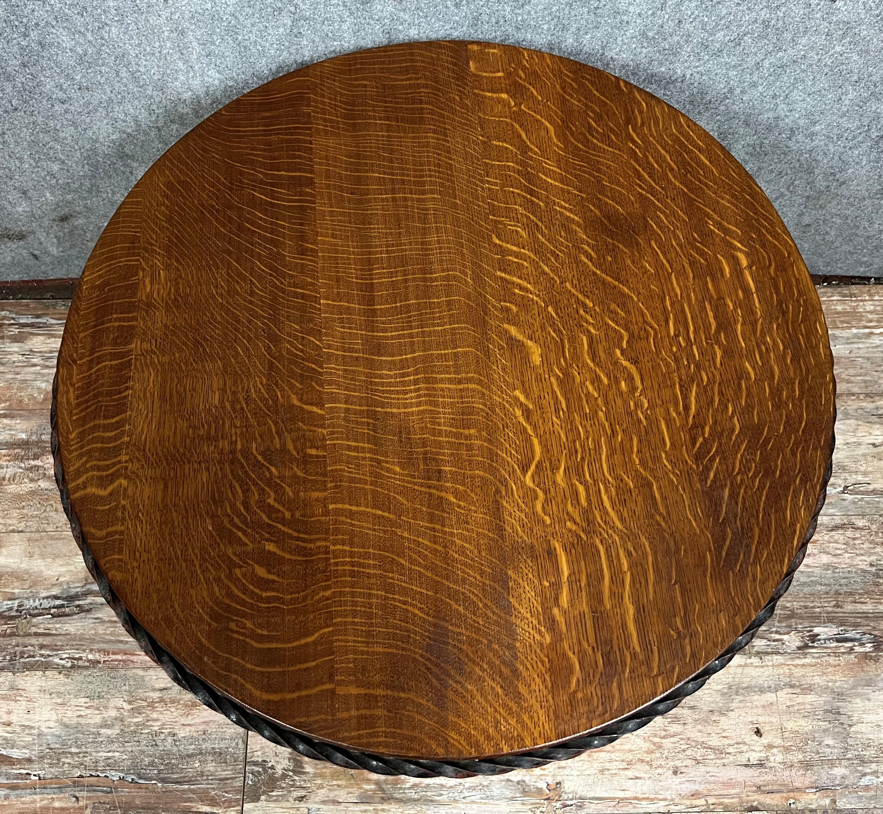 Hammered iron coffee table with circular wooden top