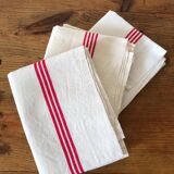 old mixed-race cotton tea towels with red bedding