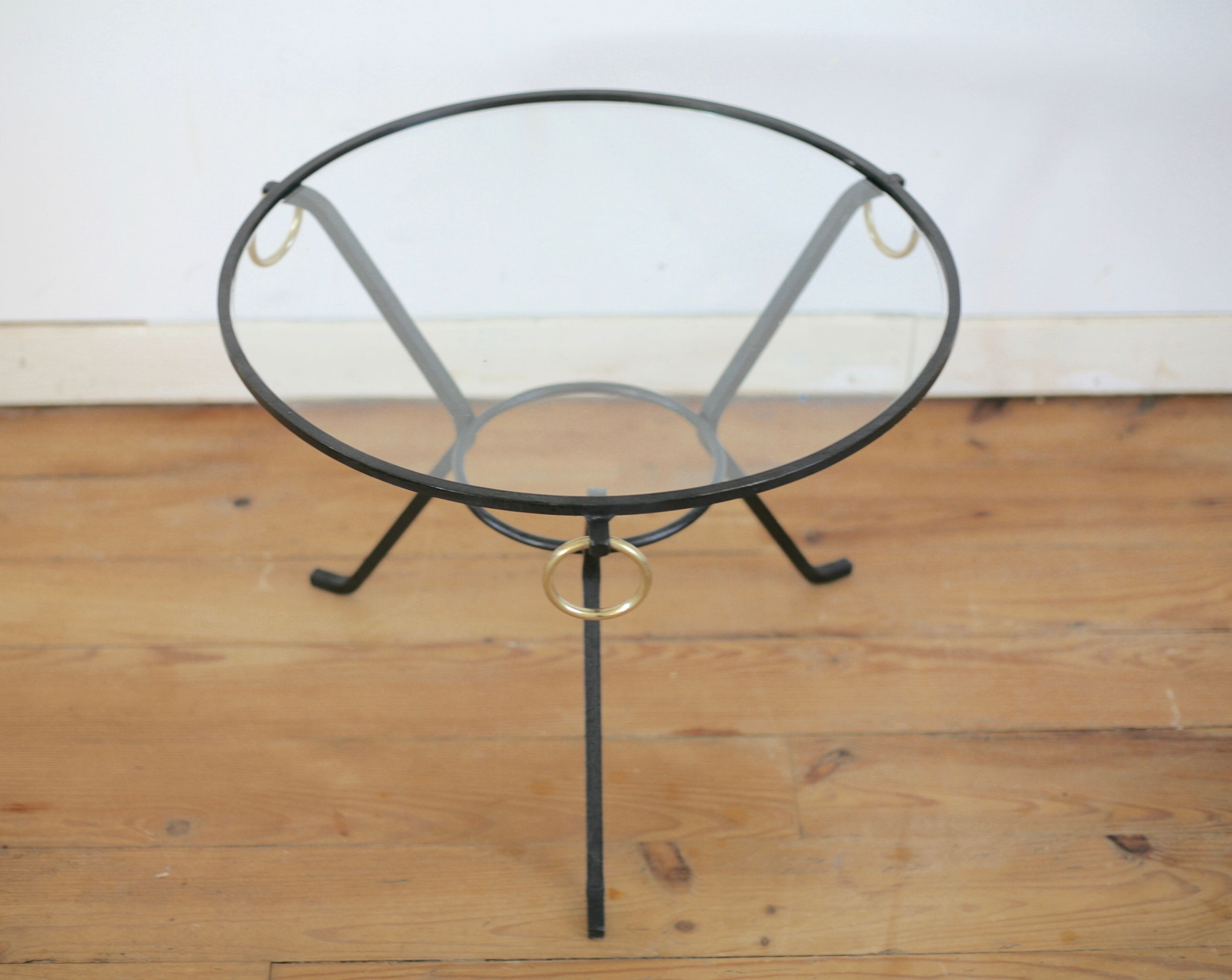 Coffee table black lacquered metal, glass and brass, France, circa 1950.