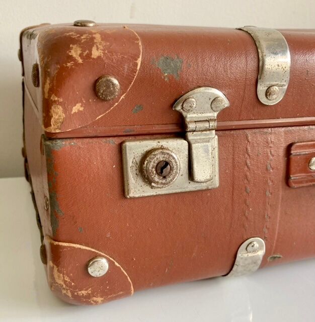 Small old brown suitcase