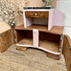 Art Deco bedside table in powder pink painted wood.