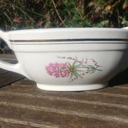 Porcelain gravy boat from the Orchies Moulin des Loups earthenware factory with lilac decoration