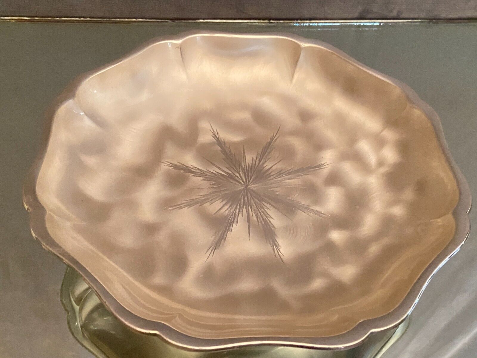 Metal dish with starry decoration