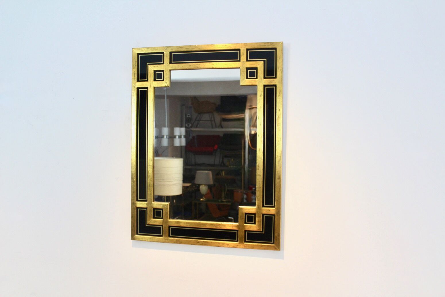 Mirror in gilded wood and black glass by Deknudt Belgium