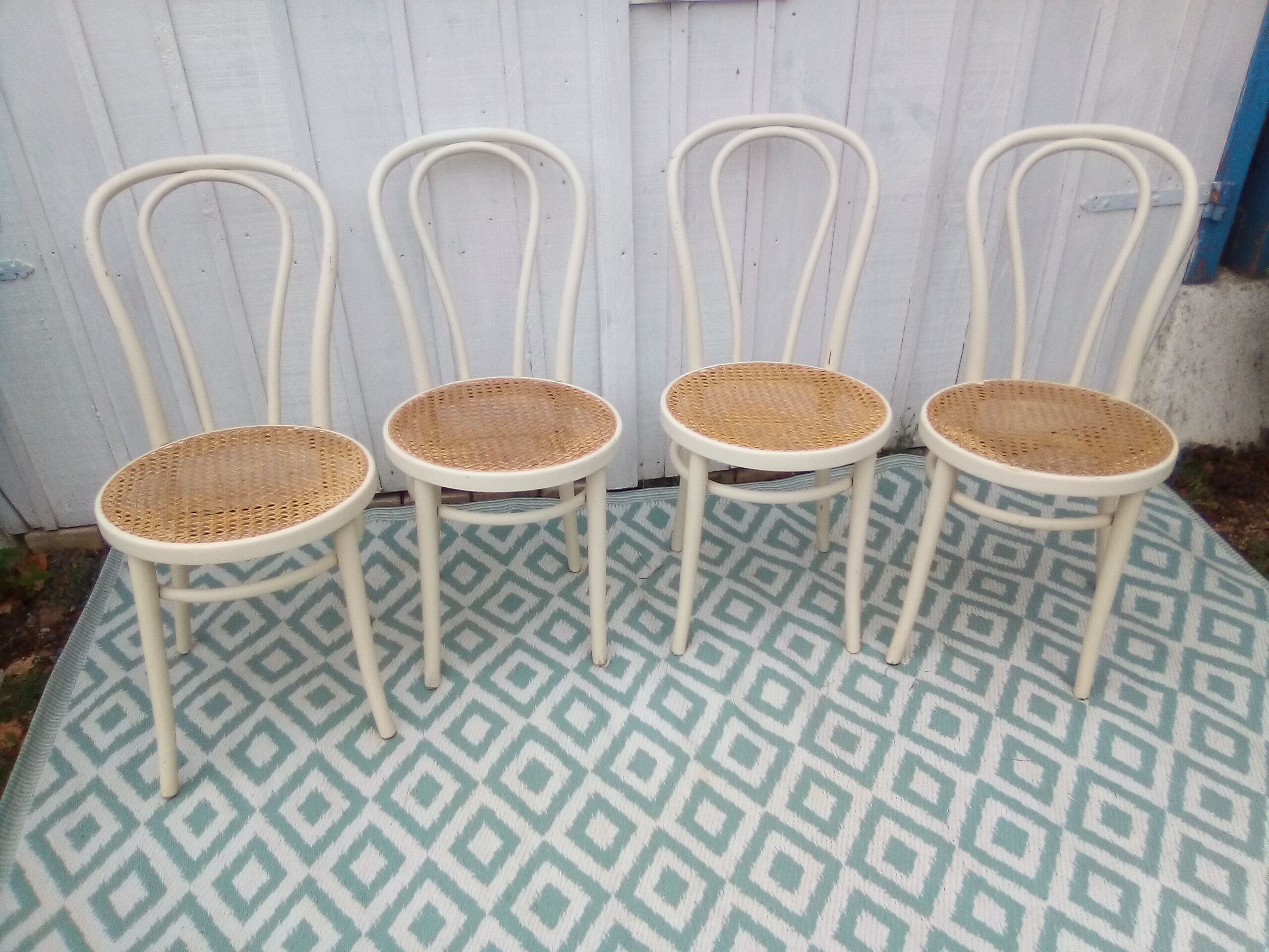 Lot of 4 bistro chairs in caned wood