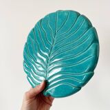 Ceramic trivet and bottle coaster from the 1950s.