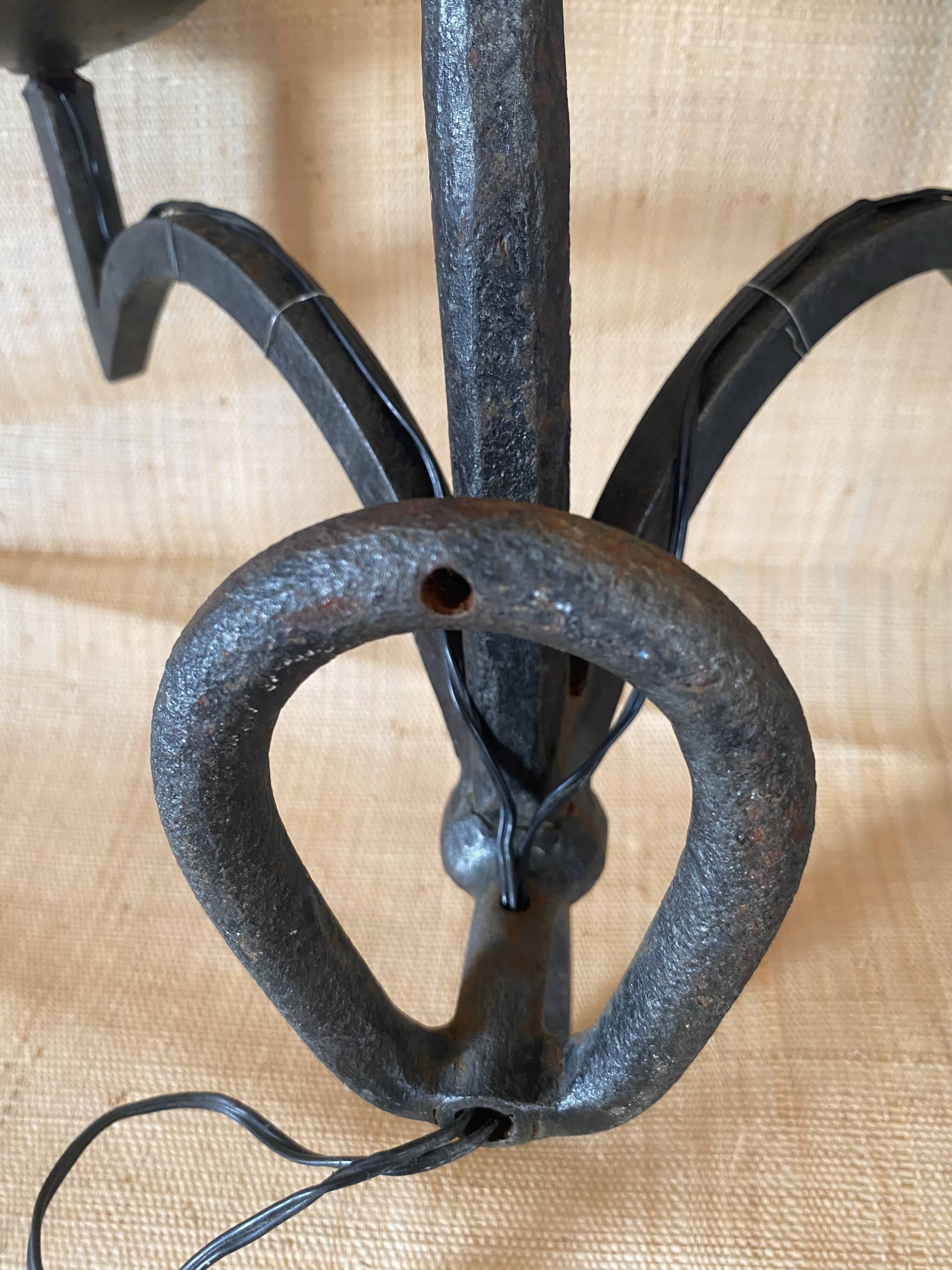 Wrought iron wall lights.