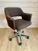 Vintage Mid-Century brown office chair with wheels from the 1970s.