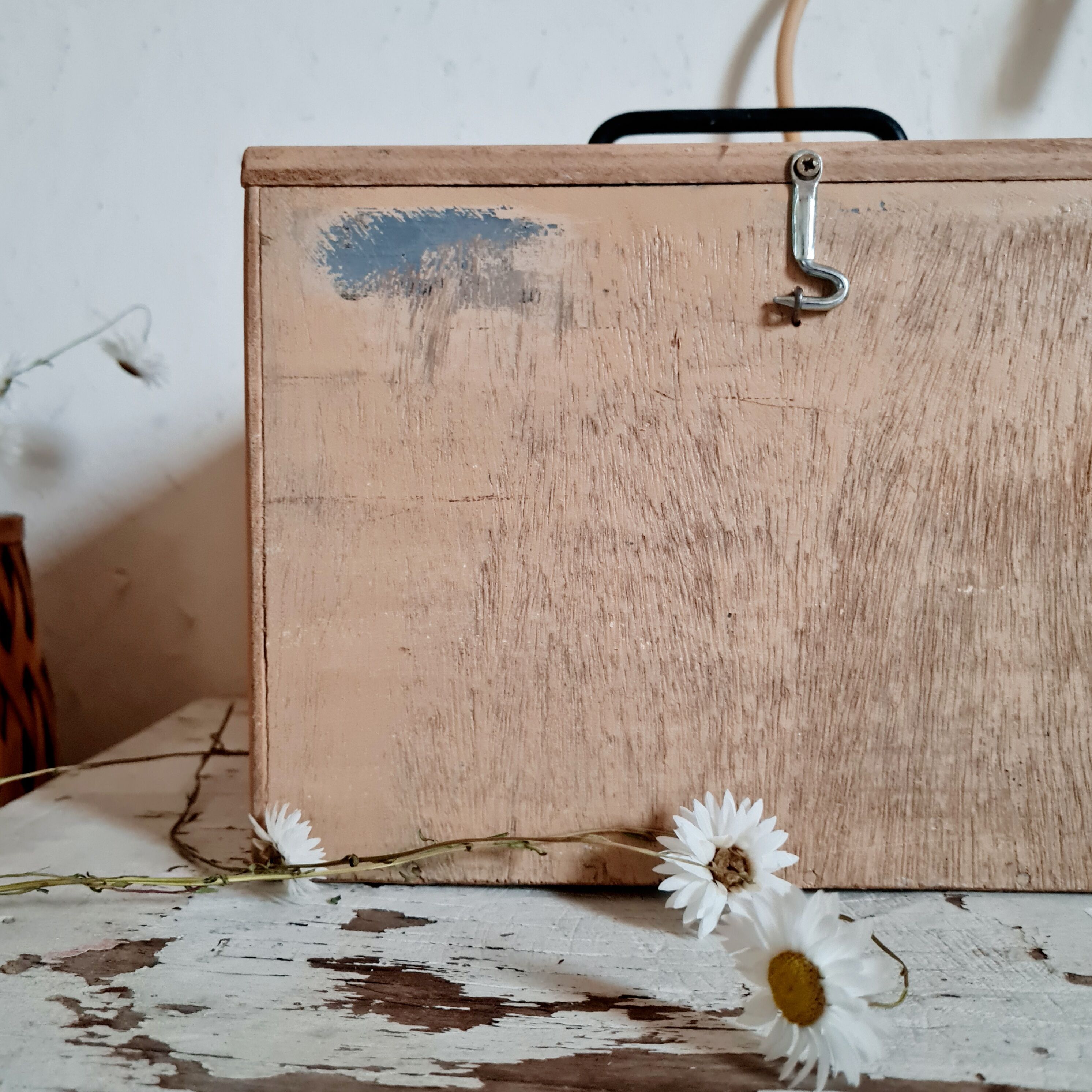 Small trunk in old wooden chest