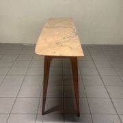 Console from the 1950s with a pink marble top and a cherry wood frame.