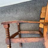 Vintage armchair in straw and brutalist wood