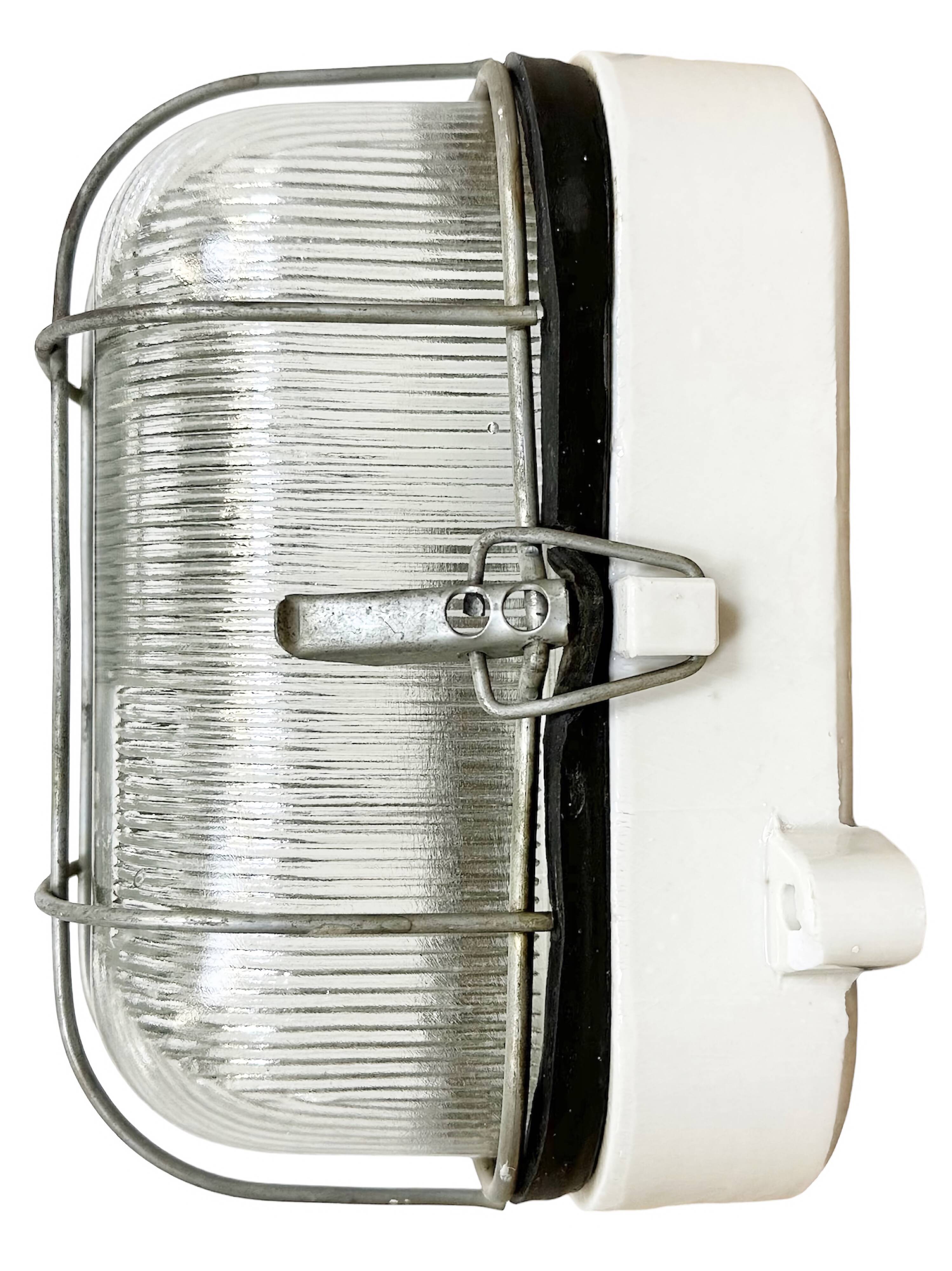 Industrial white porcelain cage wall light with ribbed glass, 1970s