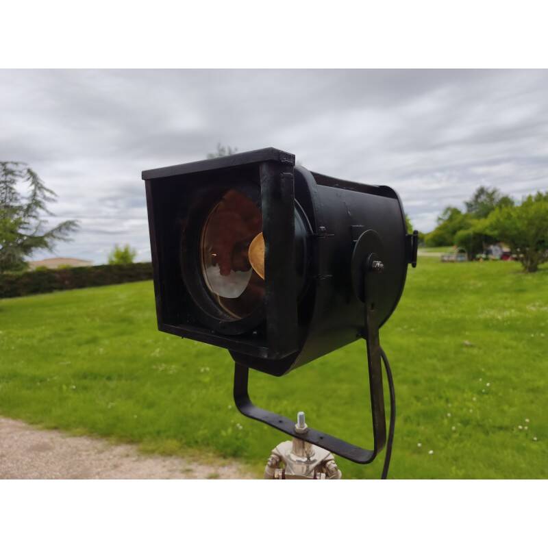 Spotlight on wooden and chrome tripod.