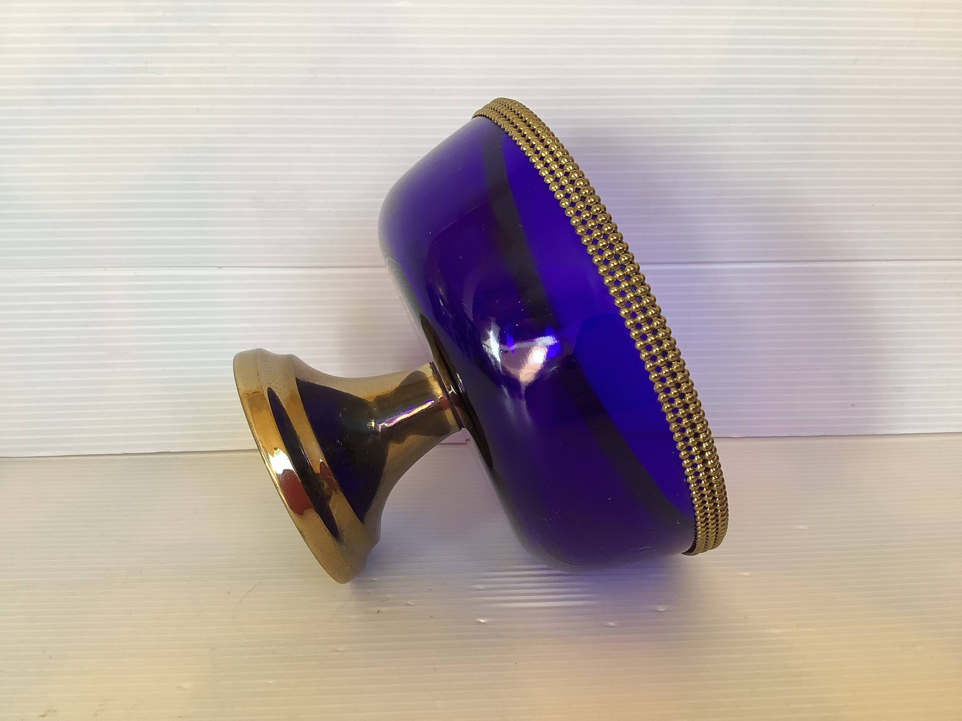 Cobalt blue trinket dish with a beaded pattern.