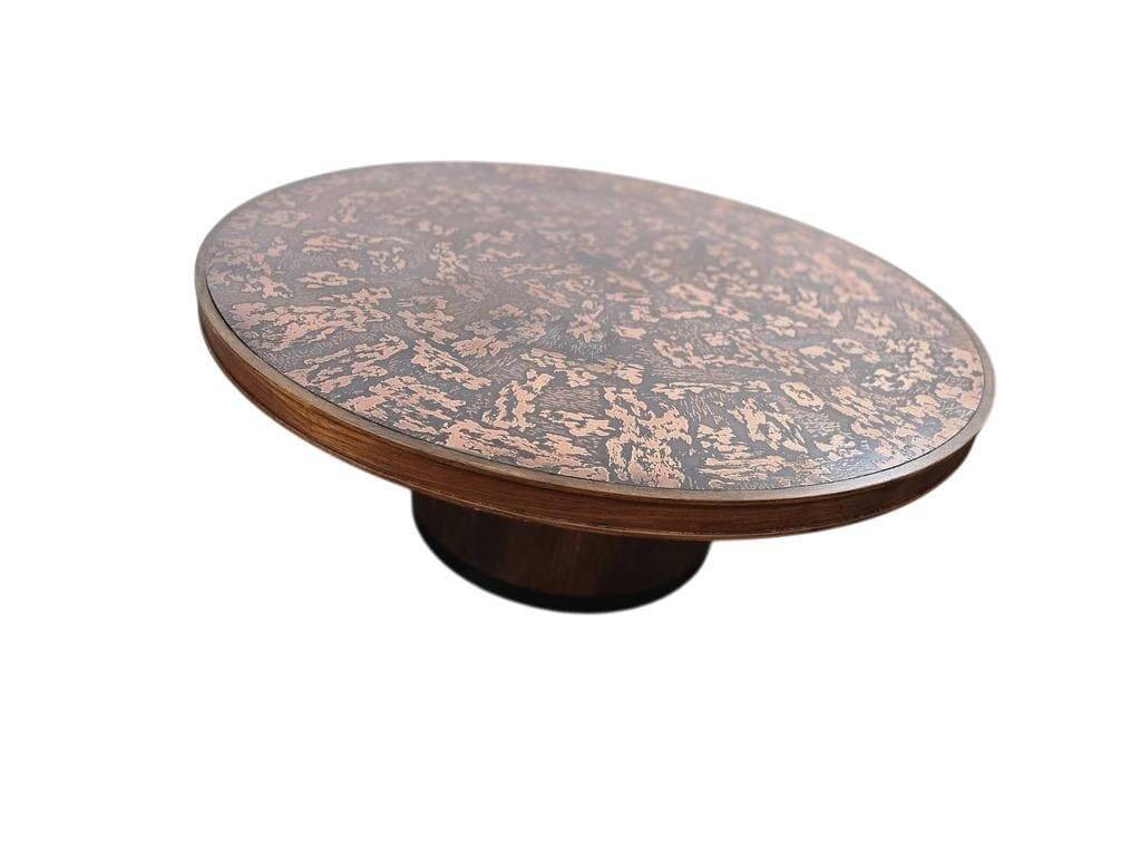 Vintage round wooden coffee table with a copper top.