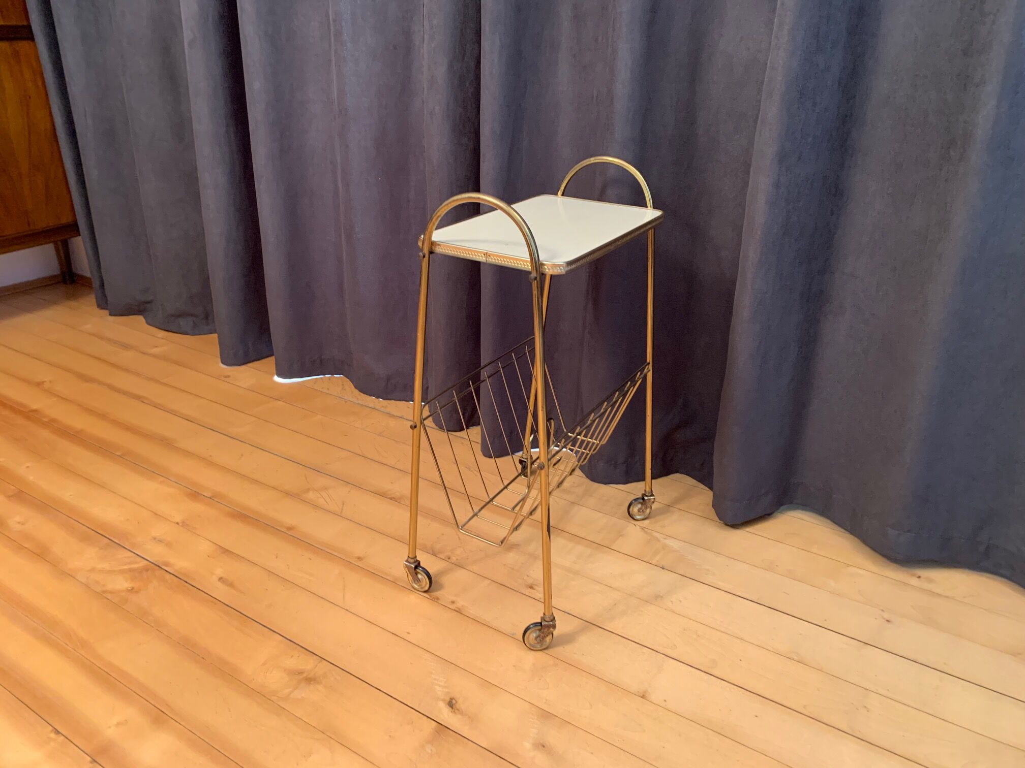 Mobile newspaper holder, 1960s