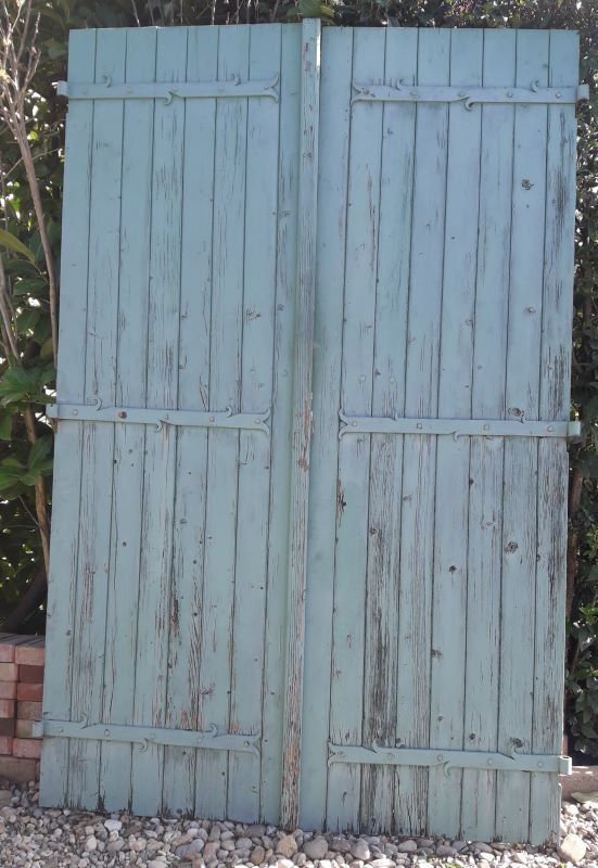 Pair of large wooden iron hanging shutters