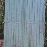 Pair of large wooden iron hanging shutters