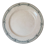 Large old round plate in iron earth