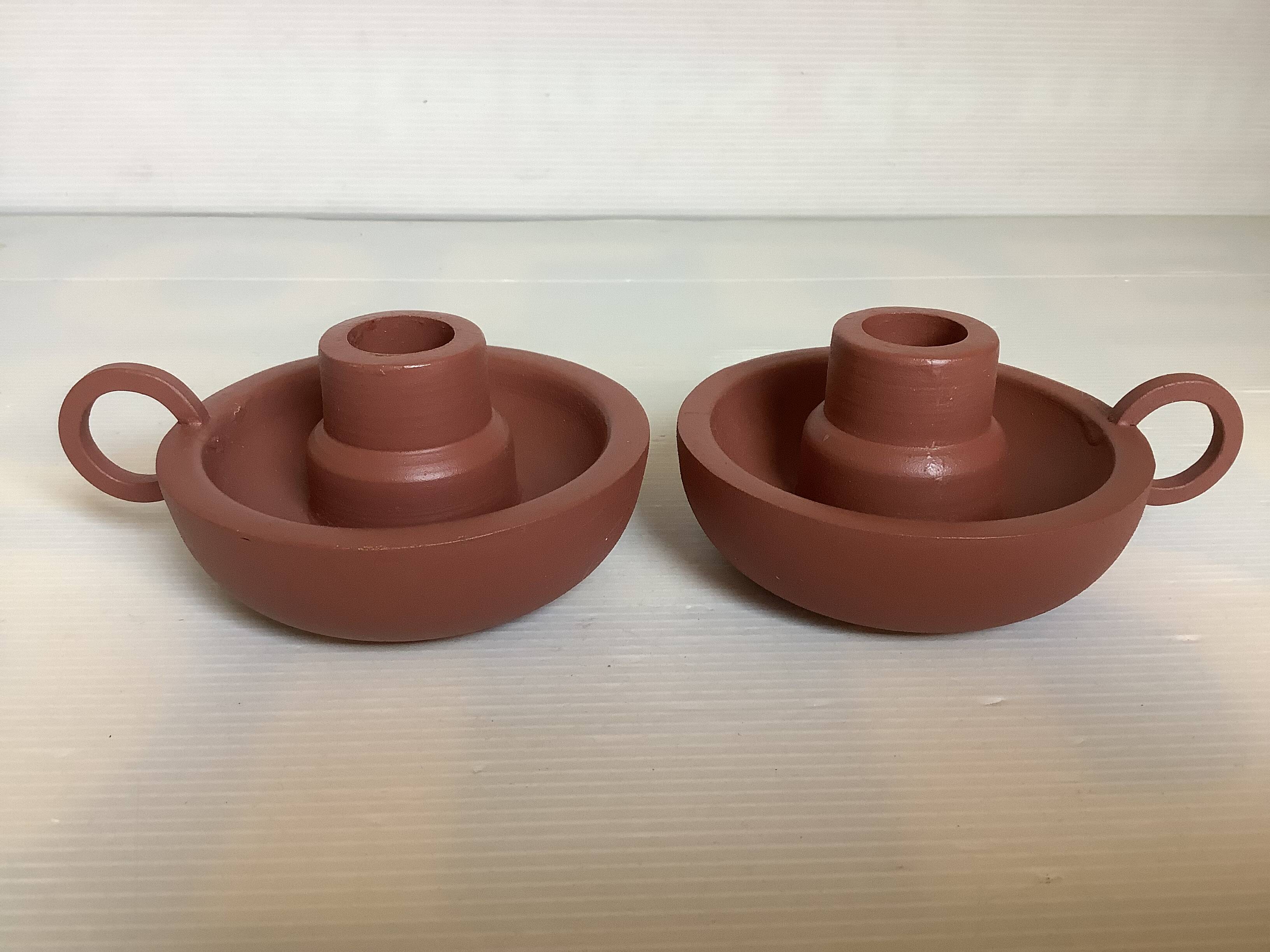 Pair of matte brown ceramic cellar rat candlesticks