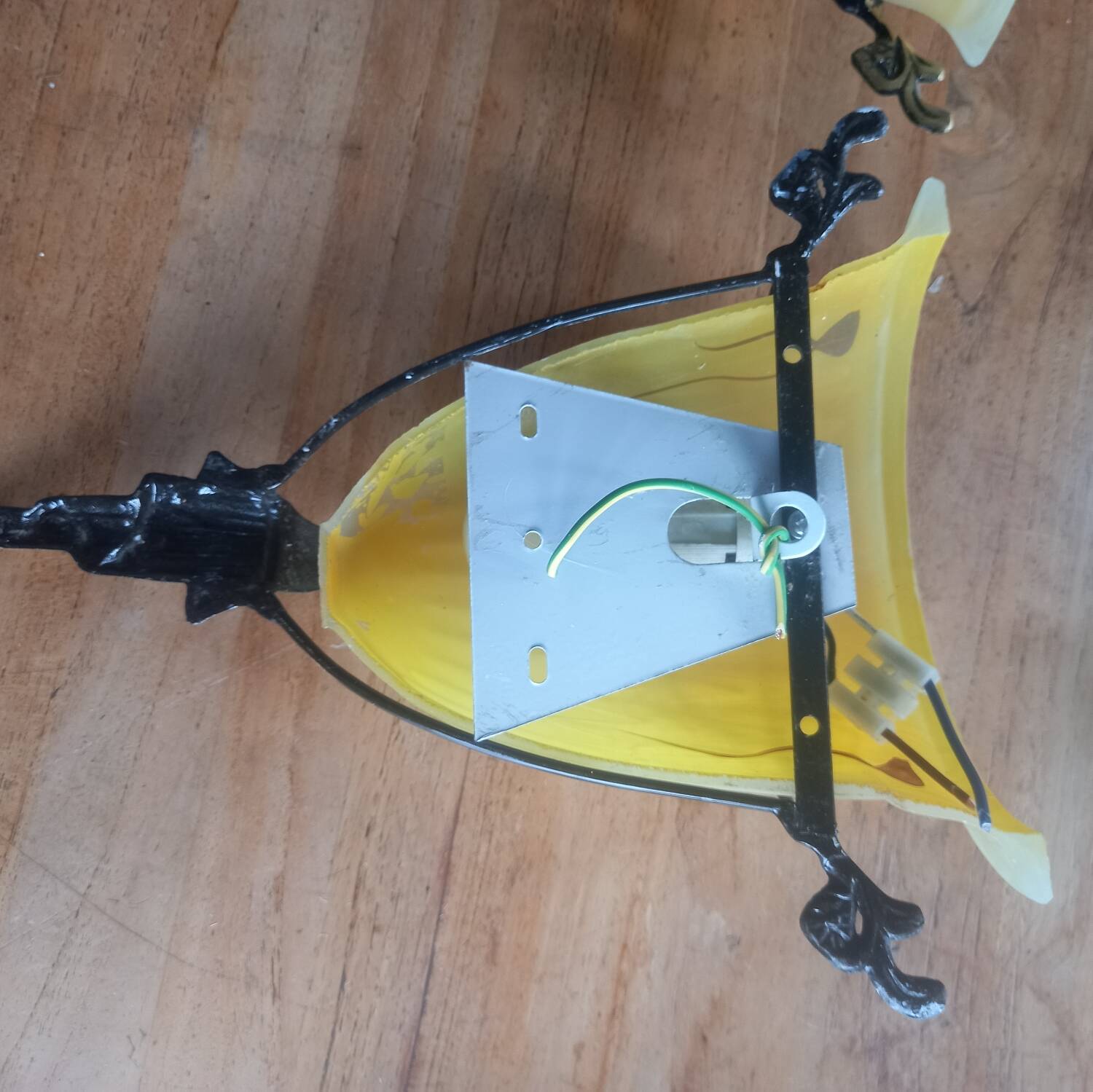 Art deco bronze wall lights with yellow glass