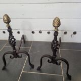 Old pair of wrought iron pegs with brass pine cone