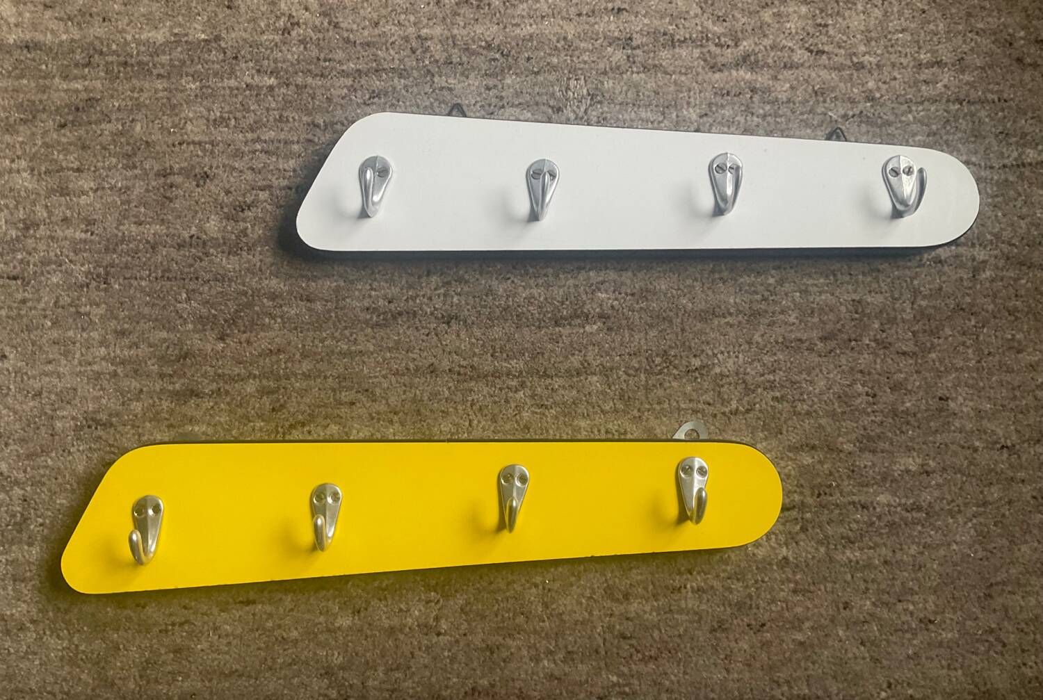 Duo of asymmetrical Formica coat racks from the 60s