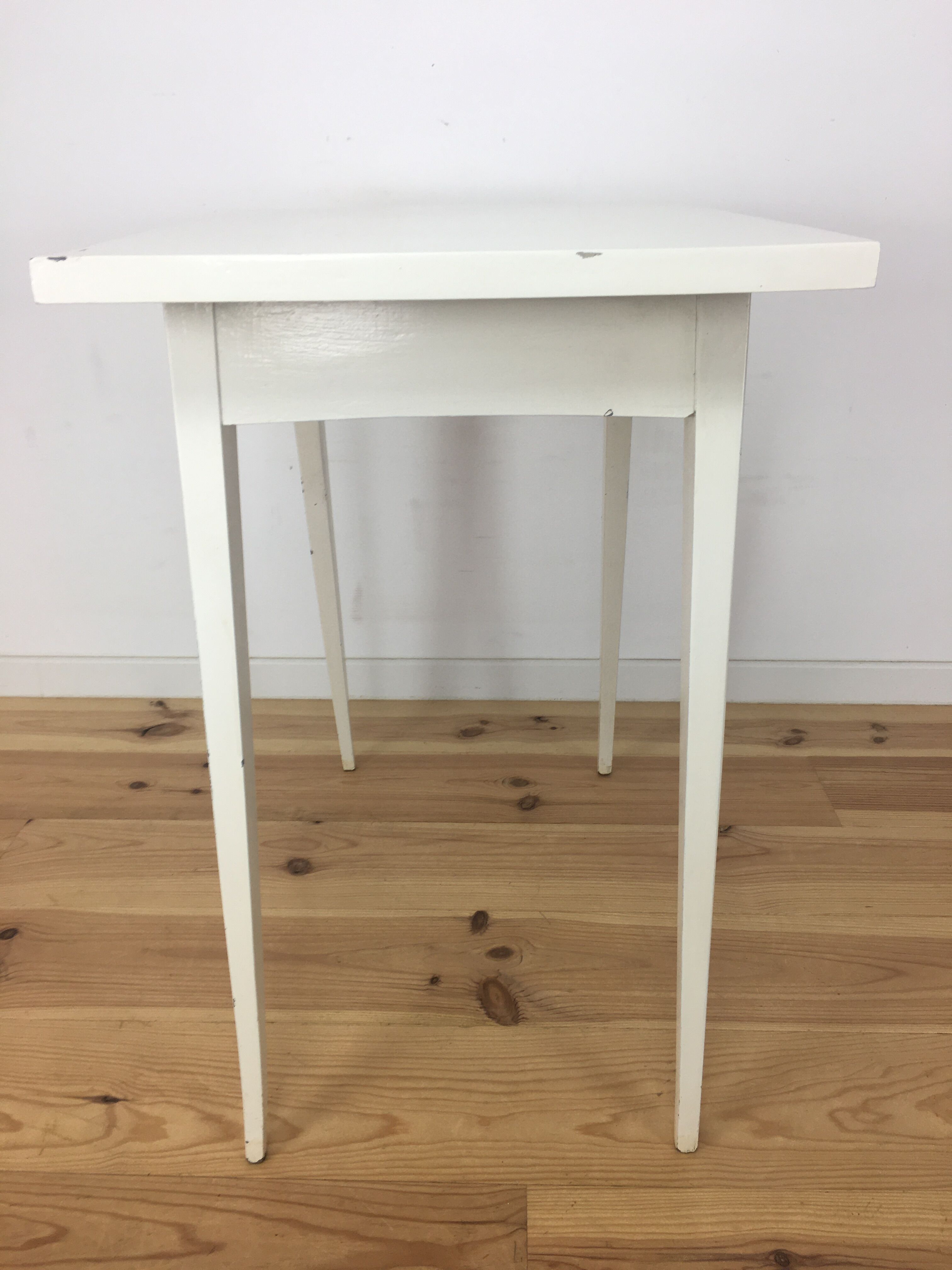 White wood desk foot compass