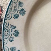 3 flat plates in ironstone with a green floral border