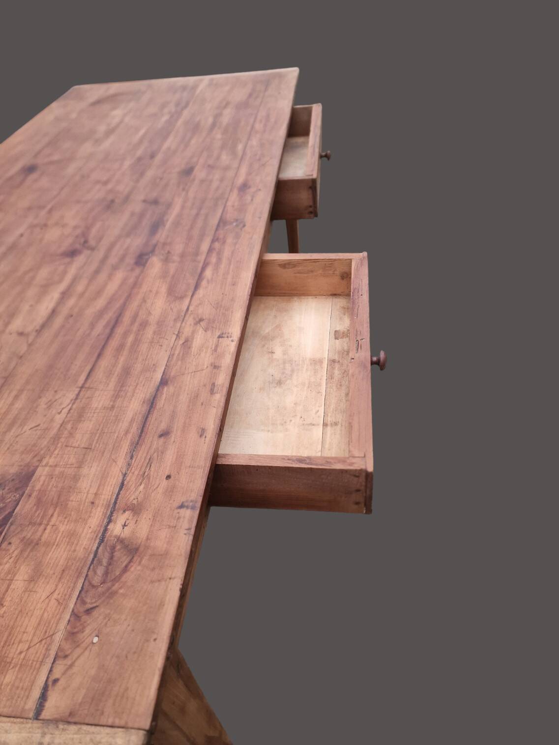 Old farmhouse table with two drawers.