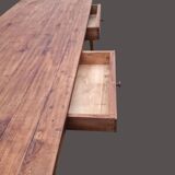 Old farmhouse table with two drawers.